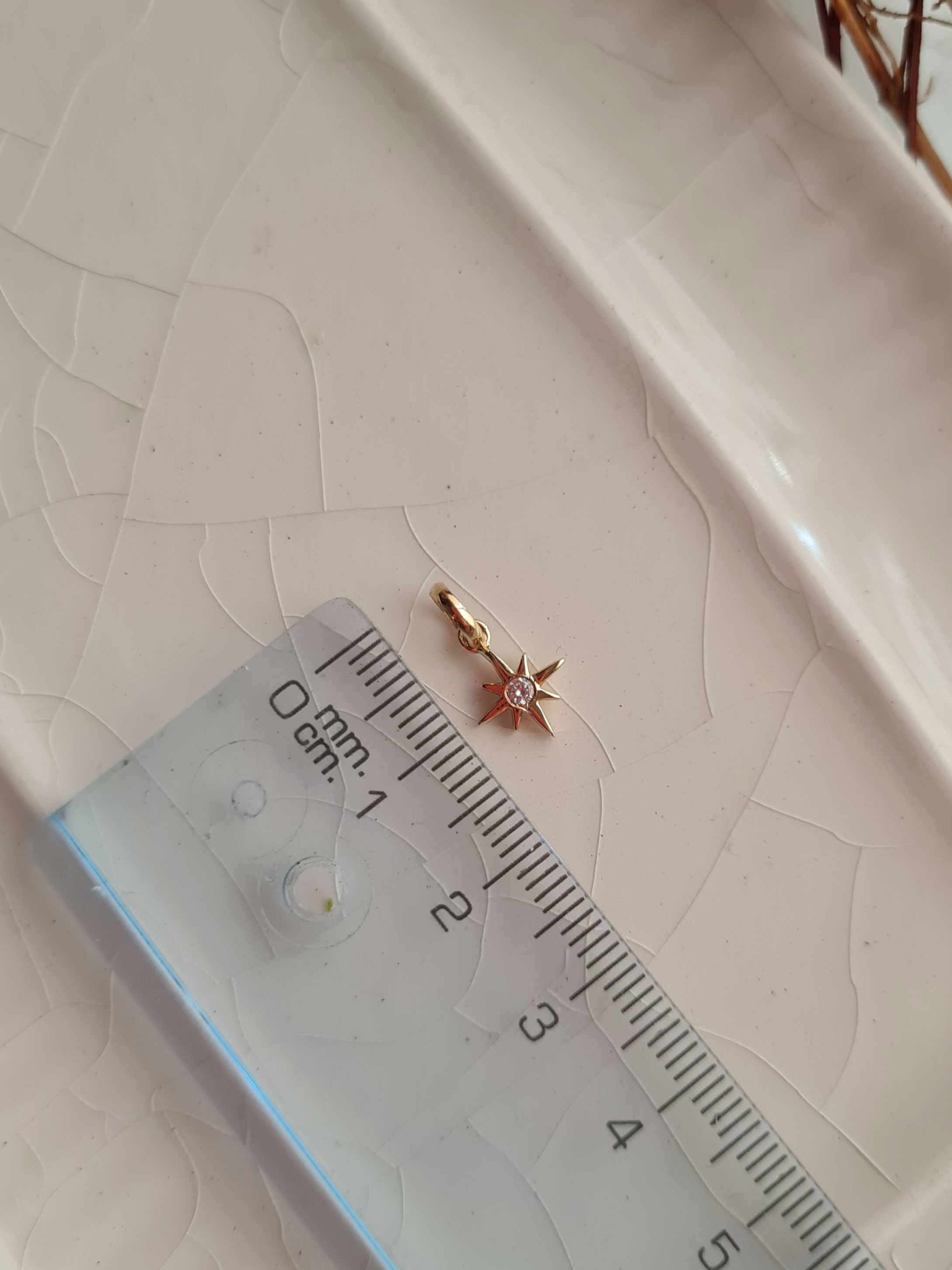 Dije Estrella del Norte Charm - Oro 18k