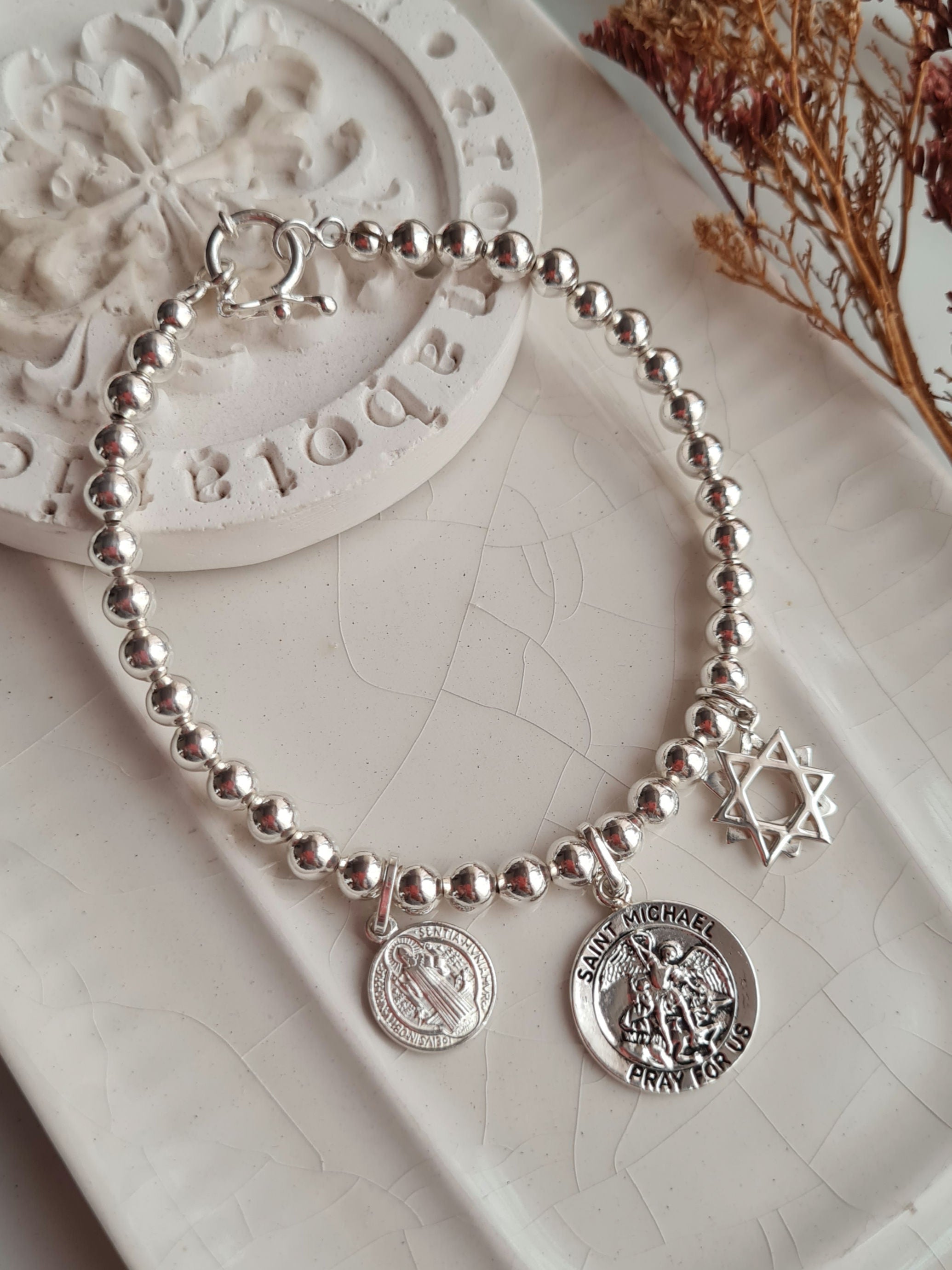 Pulsera 3 Protectores: San Benito, Arcangel Miguel & Estrella 12 Puntas - P950